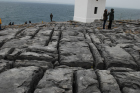 Exposures along margins of country road R477 of Dinantian Burren Limestone Formation. These Carboniferous limestons are composed of shallow water carbonates. Note the clints (limestone blocks) and grikes (joints and fractures) extensively enlarged by Pleistocene dissolution. Topography almost devoid of vegetation, though when it occurs it fills prominent grikes.